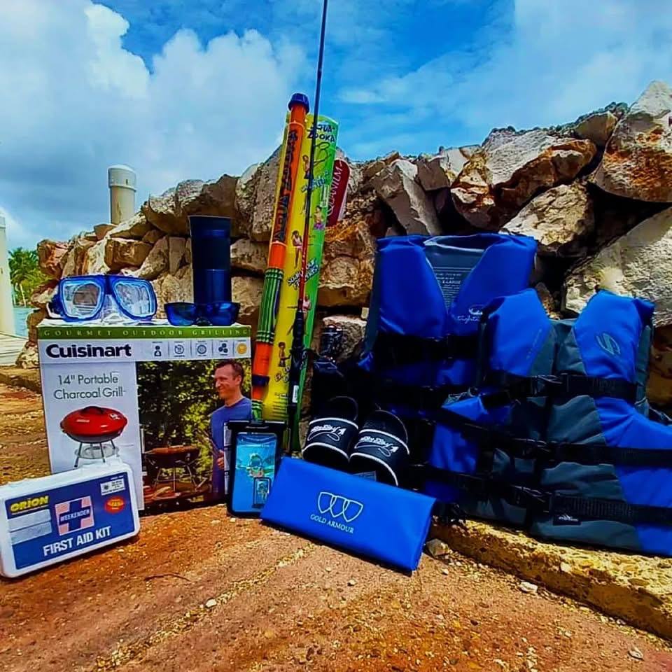 A display of Duke Marine fishing, diving and boating gear laid out in Belize City