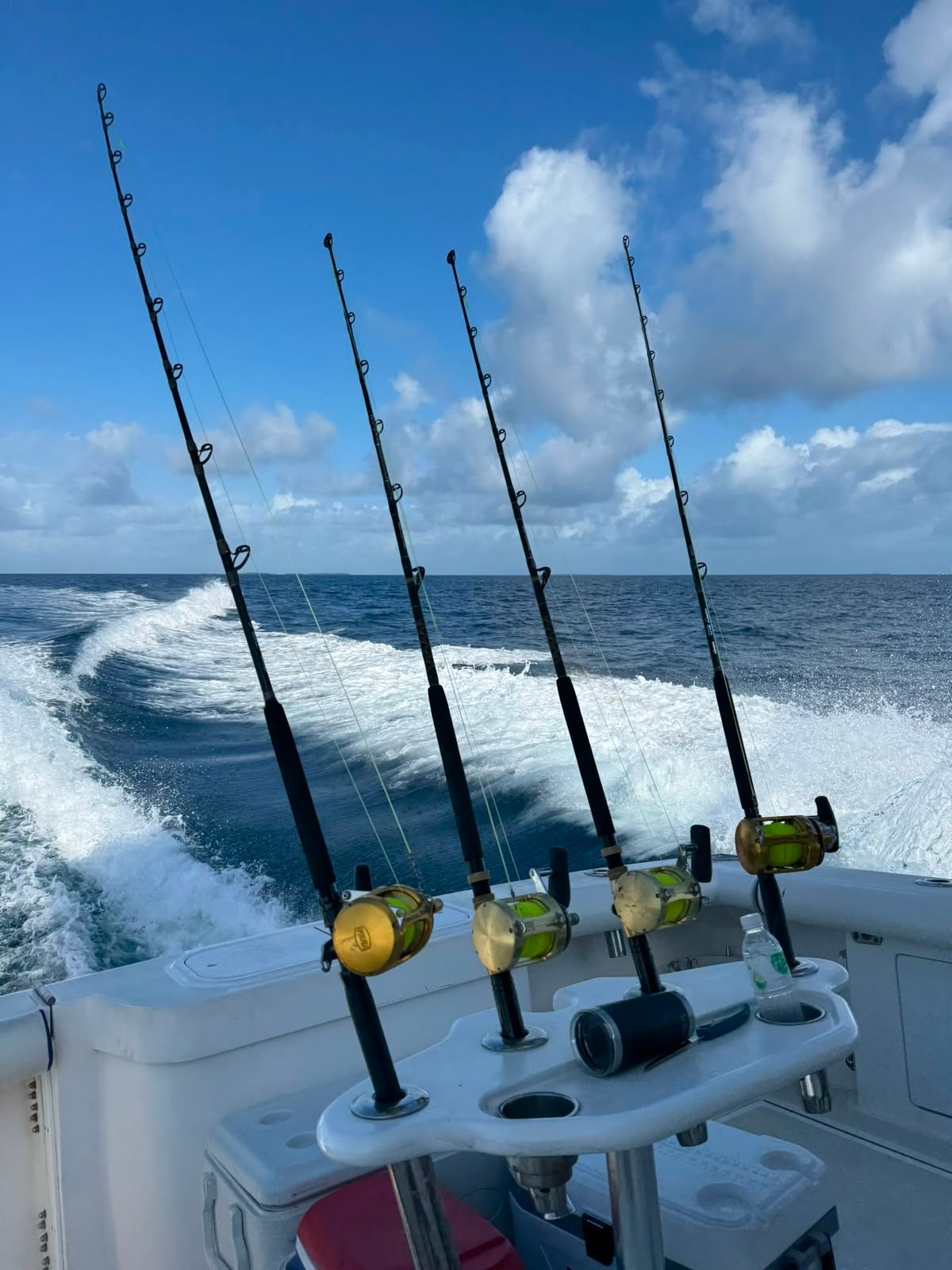 Trolling rods set as the boat runs across open water